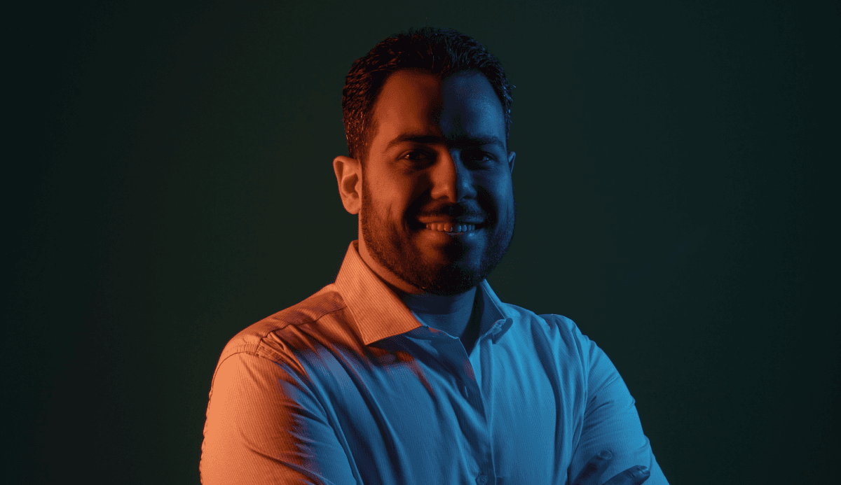 Omar Hamed in a dark background